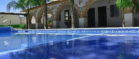 Outdoor pool, open 8:00 AM to 9:00 PM, pool umbrellas, sun loungers