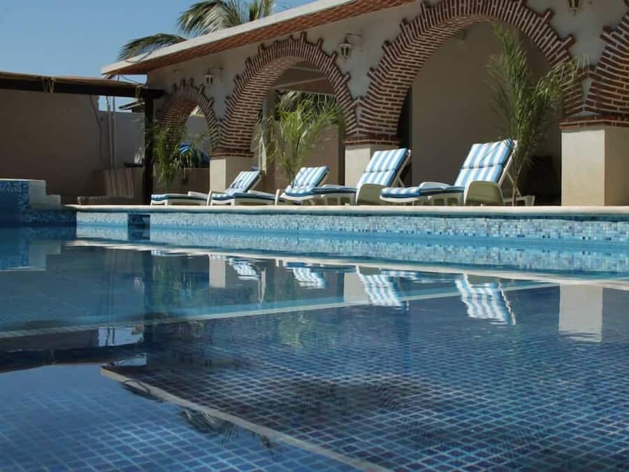Outdoor pool, open 8:00 AM to 9:00 PM, pool umbrellas, sun loungers