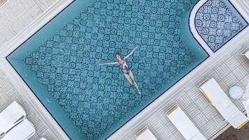 Seasonal outdoor pool, open 6:00 AM to midnight, free cabanas