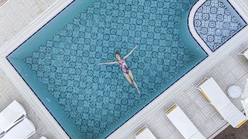 Seasonal outdoor pool, open 6:00 AM to midnight, free pool cabanas