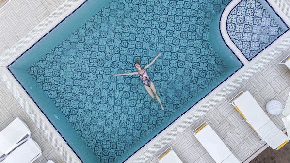 Seasonal outdoor pool, open 6:00 AM to midnight, free pool cabanas