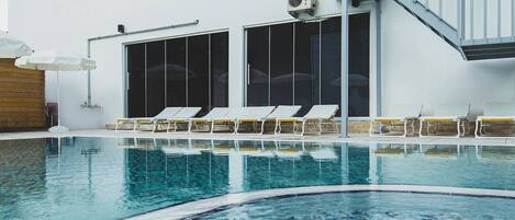 Seasonal outdoor pool, open 6:00 AM to midnight, free cabanas