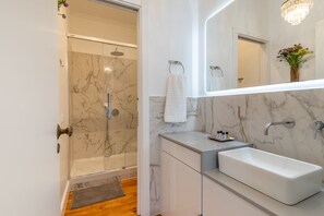 Shower, hair dryer, towels, soap