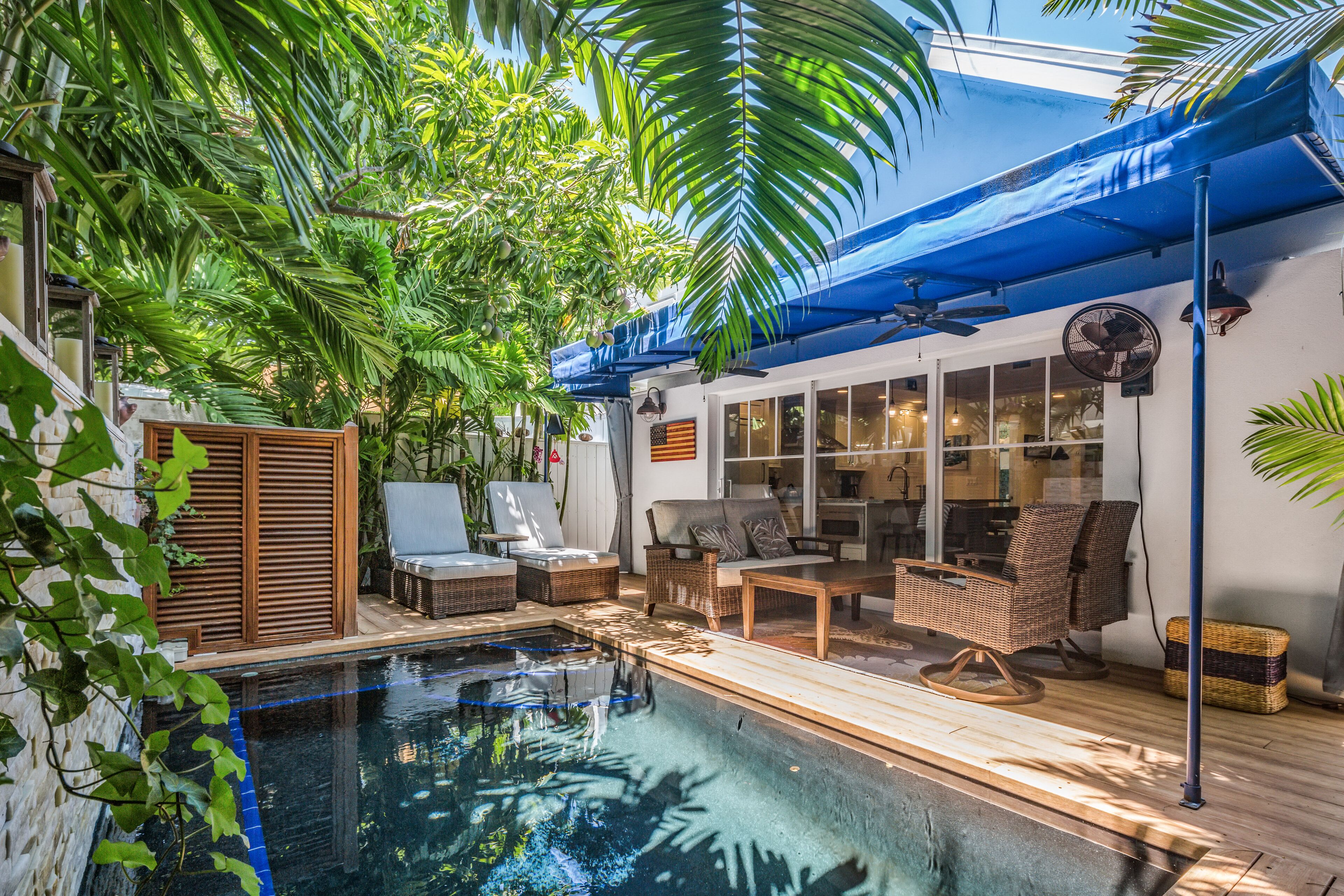 Updated home with private pool, patio, & grill in enclosed tropical backyard