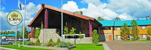 Stunning hotel with a unique architectural style, surrounded by beautifully maintained gardens.