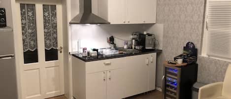 Fridge, microwave, stovetop, coffee/tea maker