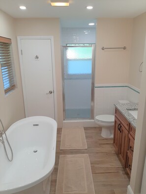 Bathtub, hair dryer, towels, soap