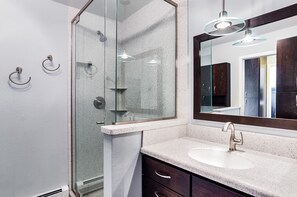 Shower, hair dryer, towels, toilet paper