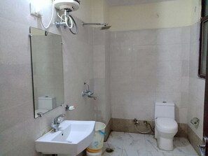 Shower, free toiletries, slippers, towels