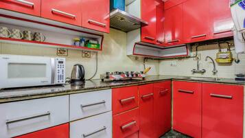Fridge, microwave, electric kettle, cookware/dishes/utensils