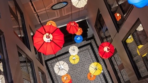 A ceiling with hanging umbrellas in various colors. - Babylon Premium Hotel & Spa (Hanoi)
