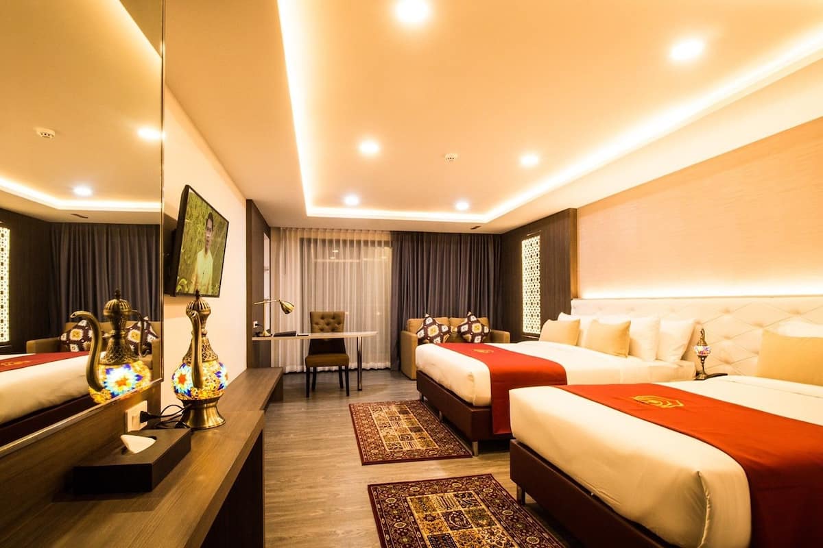 family room | 1 bedroom, minibar, in-room safe, desk