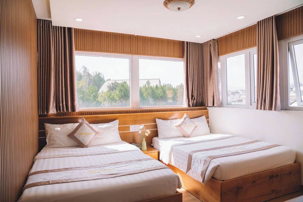Deluxe Quadruple Room | Premium bedding, memory foam beds, desk, laptop workspace