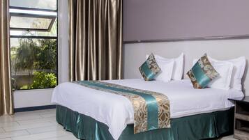 Premium bedding, memory-foam beds, minibar, in-room safe
