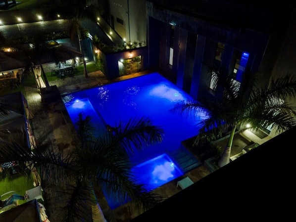 Outdoor pool, open 7:00 AM to 9:00 PM, pool umbrellas, pool loungers