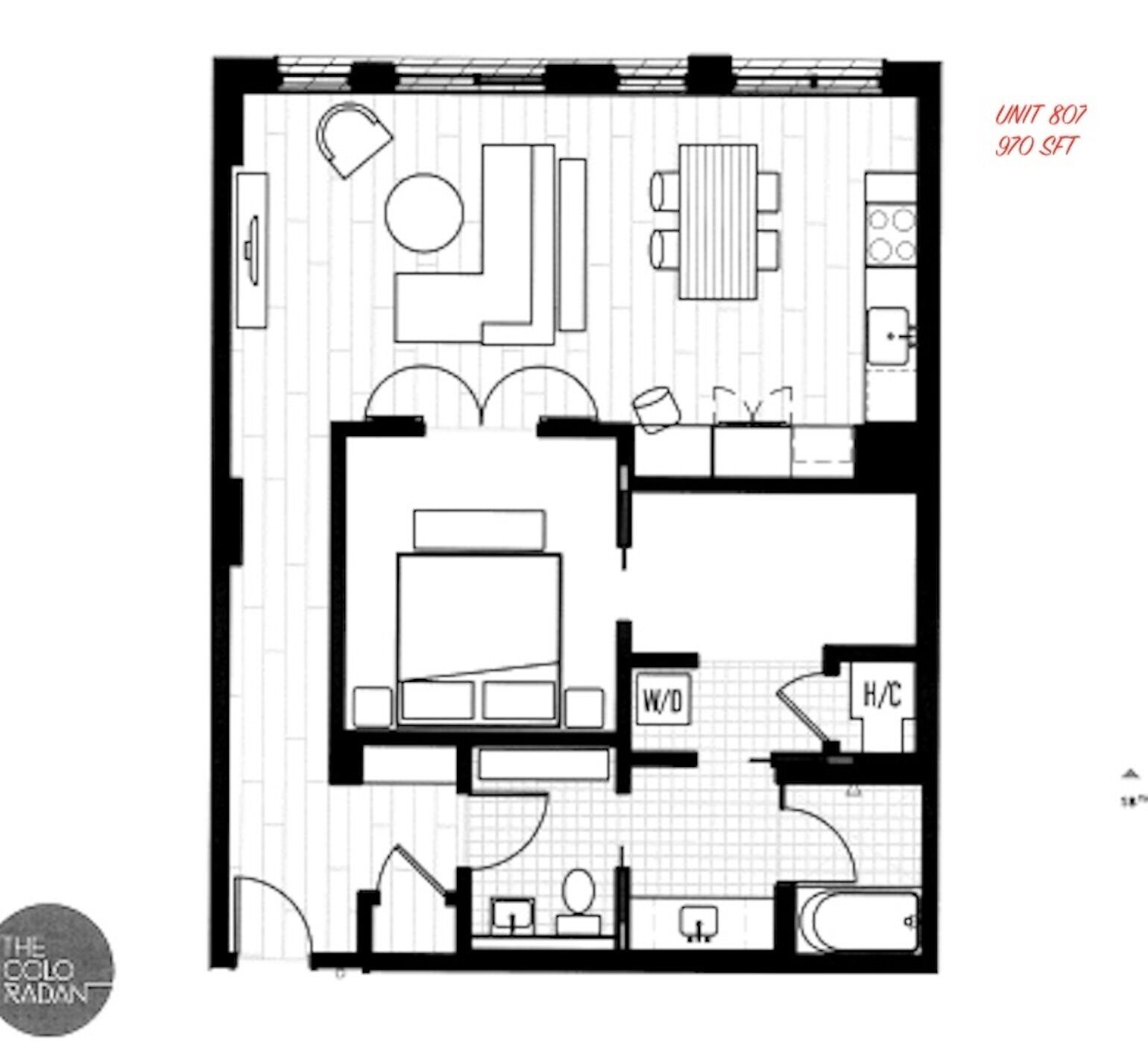 A floor plan of a hotel room with a bed, a desk, a chair, a small table, a sofa, a bathroom, and a kitchen area.