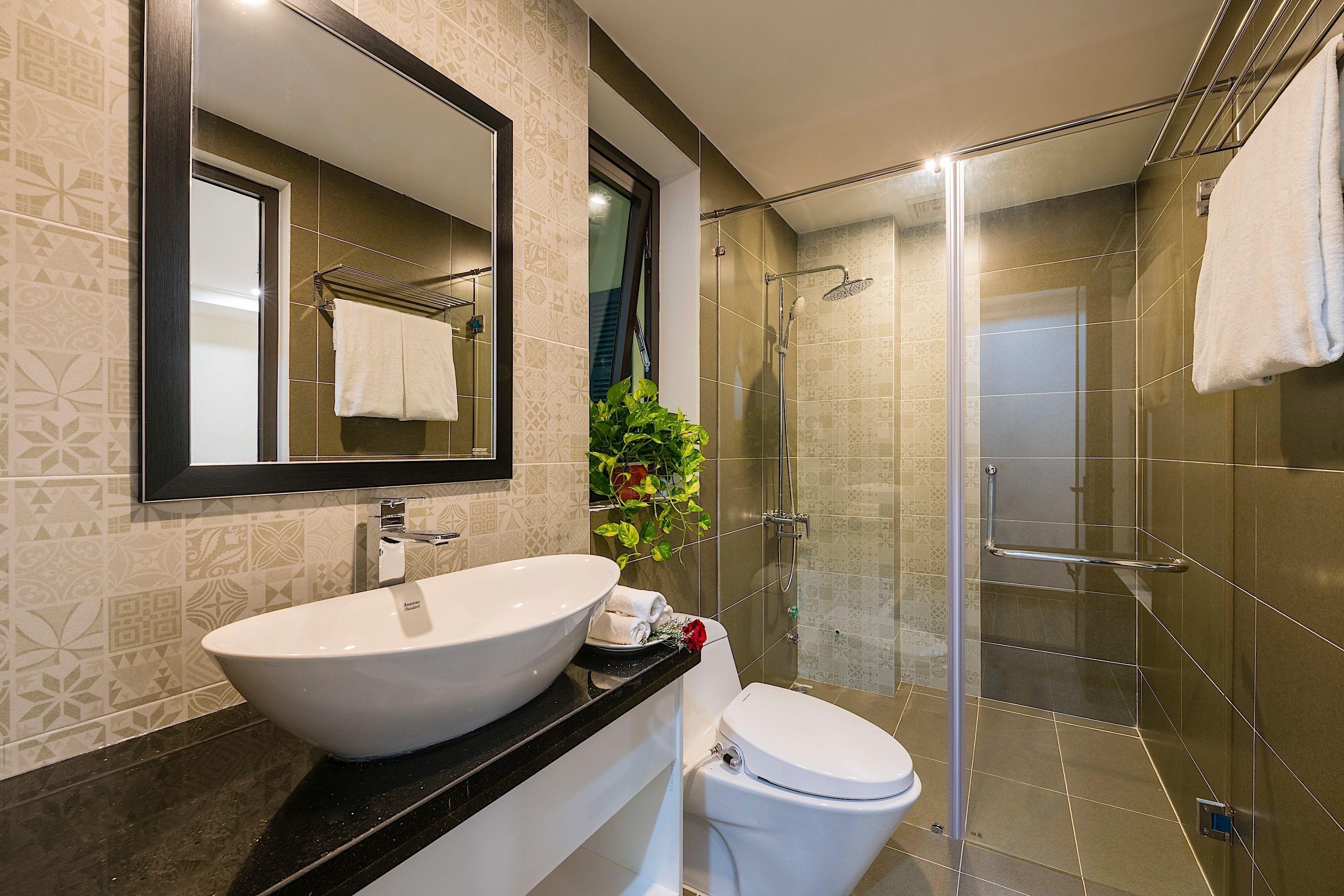 family balcony with courtyard view | bathroom | shower, free toiletries, hair dryer, slippers