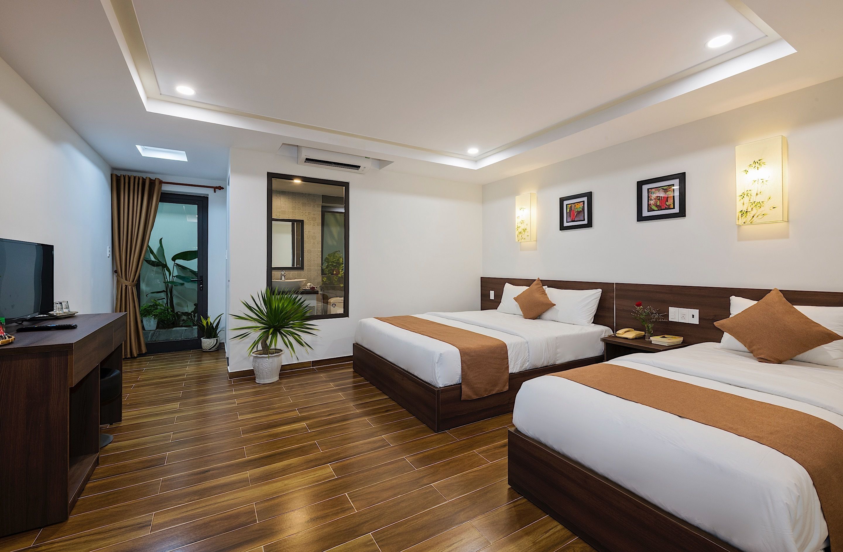 deluxe triple room | minibar, in-room safe, desk, laptop workspace