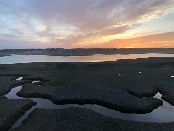 A natural landscape with a body of water, grassy areas, and a distant horizon. - Modern house at Wells Beach - Available Winter Rentals Off Season-reduce rate. (Wells)