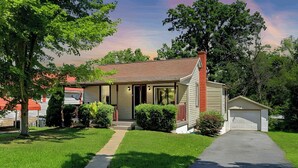A single-story house with a front porch, a garage, and a well-maintained lawn. - Cozy House, Pets Welcome, Minutes from Harrisburg (Duncannon)
