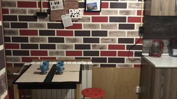 Fridge, microwave, cookware/dishes/utensils, cleaning supplies