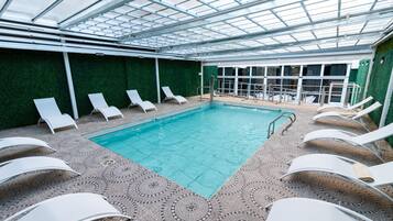 Outdoor pool, open 10:30 AM to 8:00 PM, pool loungers
