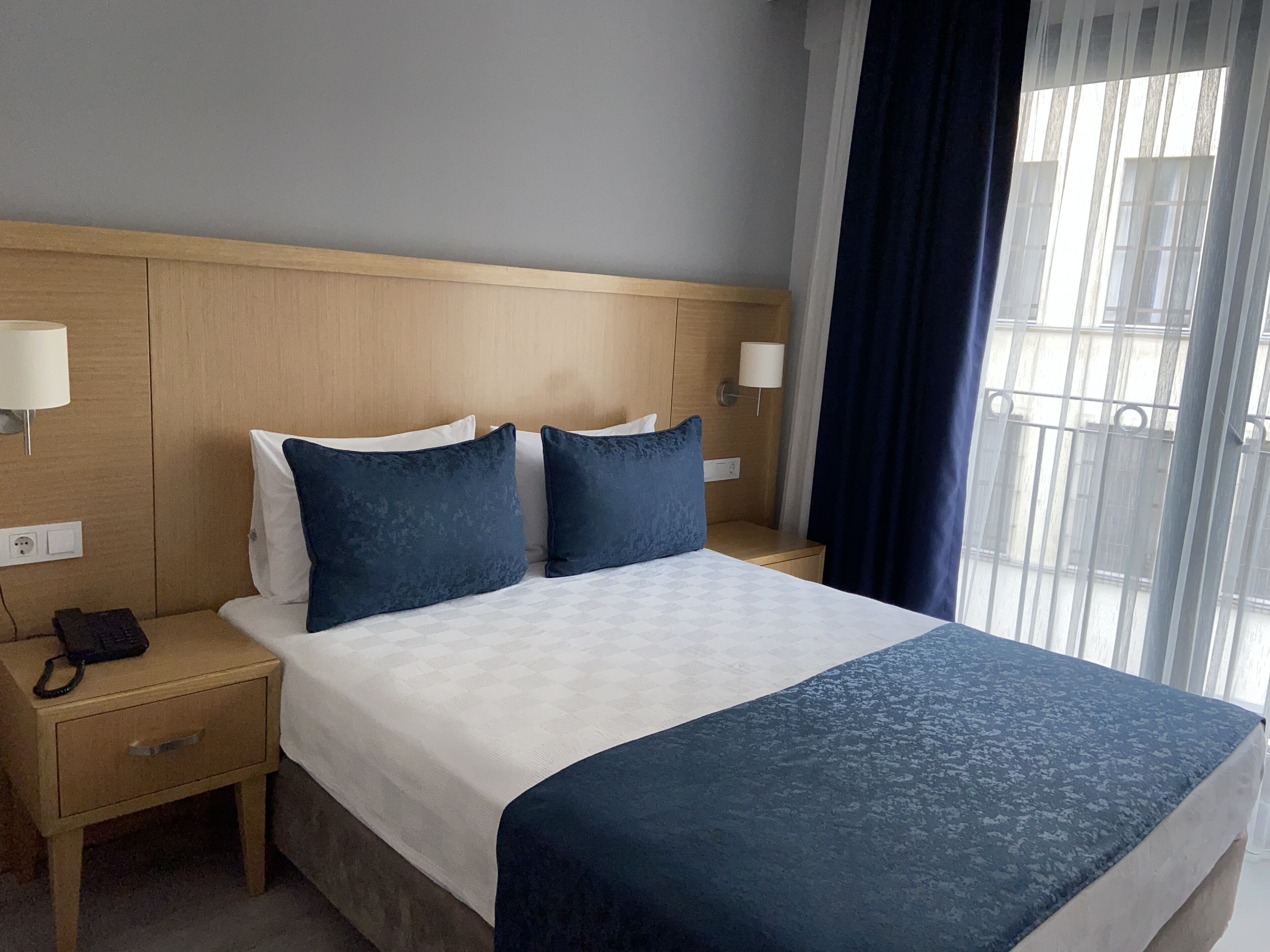 economy double room, city view | premium bedding, free minibar items, in-room safe, blackout curtains