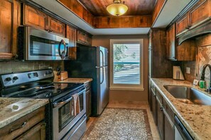 Fridge, microwave, oven, stovetop - 202 Athena Ares Beach Escape | Pool • Hot Tub • Pets (South Padre Island)