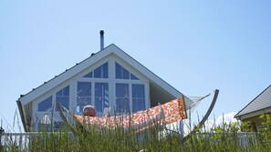 Exterior - 5-star vacation home "Thor's Schleilounge" directly on the Schlei and Baltic Sea with a view of the water, to treat yourself to a well-deserved break from everyday life as a couple or with the family in the Baltic Sea resort of Olpenitz (Ostseeresort Olpenitz)