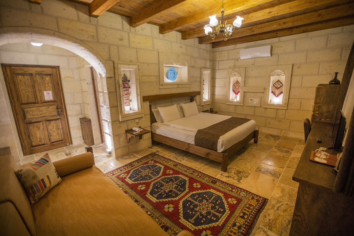 Stone Room with Balcony | Minibar, in-room safe, soundproofing, iron/ironing board