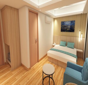 A modern bedroom with a bed, a blue armchair, a small table, and a wardrobe. - Metropark Inn (Coimbatore)