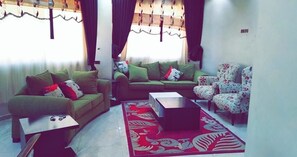 Apartment, 4 Bedrooms | Living area