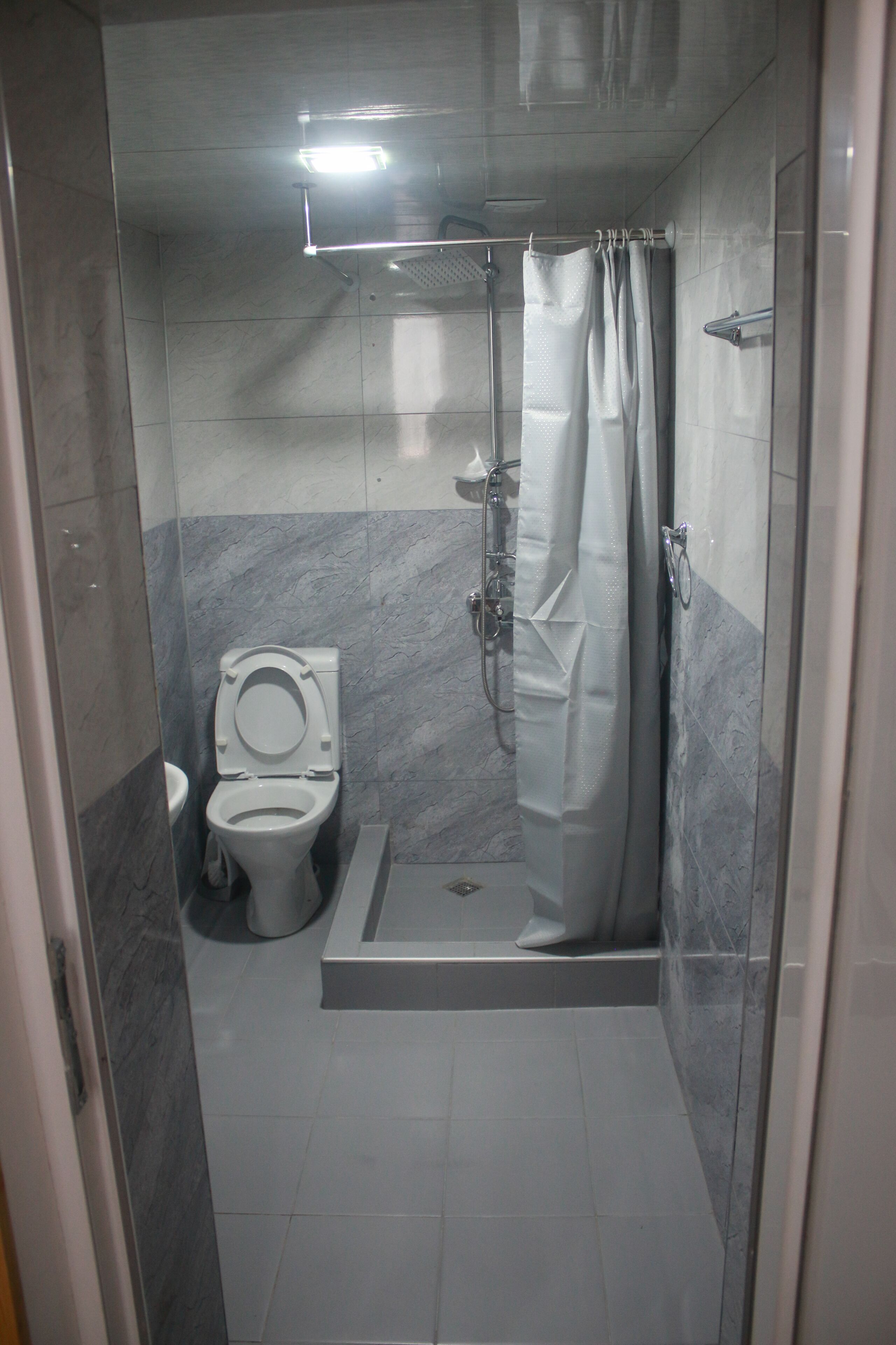 Hair dryer, slippers, towels, shampoo