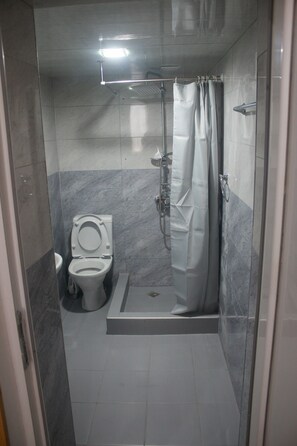 Hair dryer, slippers, towels, shampoo