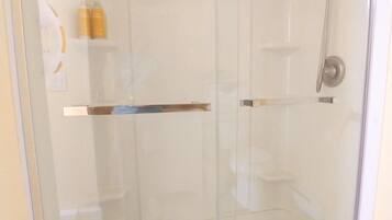 Combined shower/tub, hair dryer, towels, soap