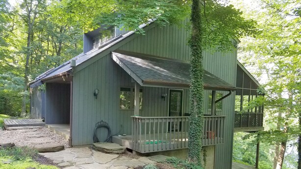 A rustic cabin with a stone pathway leading to a wooden porch, surrounded by lush greenery. - Scenic Setting Just 8 Minutes From Athens (Athens)