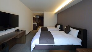 A hotel room with two beds, a flat-screen TV, a desk, and a bathroom in the background. - Hotel Promote Hiroshima (Hiroshima)