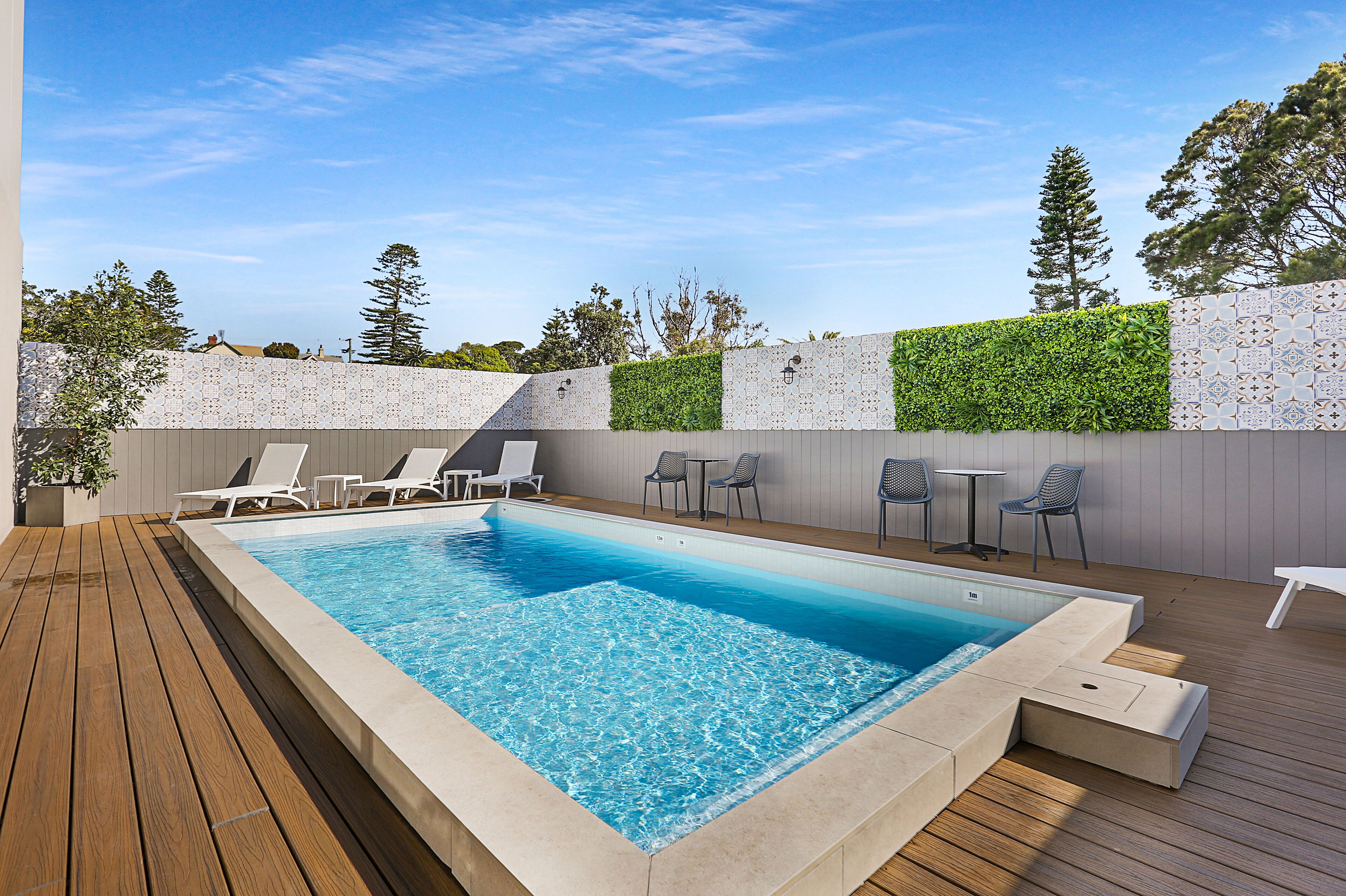 outdoor pool, open 7:00 am to 9:00 pm, pool loungers