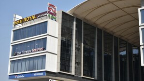 A building with a Subway restaurant, Hotel Royal, and The Fitness Forever. - Hotel Royal Residency (Vadodara)