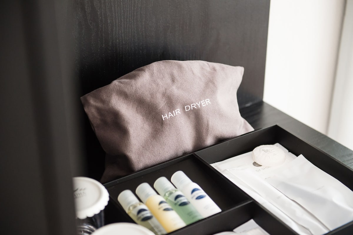 hair dryer, bathrobes, slippers, towels