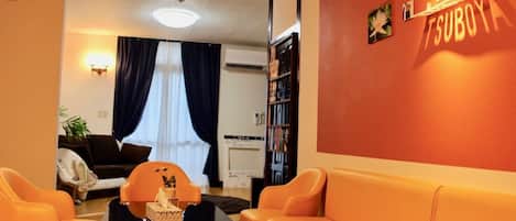 Appartement, 3 chambres | Coin séjour | Télévision à écran plat