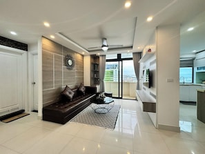 Design Apartment | Living area | Flat-screen TV