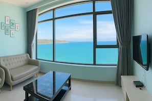 Panoramic Apartment, 2 Bedrooms | Living room | 43-inch Smart TV with cable channels, TV