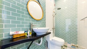 A bathroom with a white sink, a toilet, and a shower. - Seven A Hotel (Xuan Huong - Da Lat)