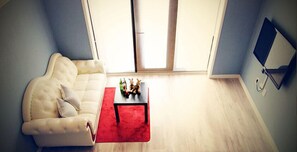 Habitación | Sala de estar | Televisión de pantalla plana 