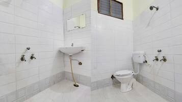 Economy Room | Bathroom | Shower, free toiletries, towels, soap