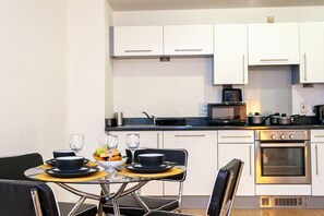 Exclusive Apartment | Private kitchen | Fridge, microwave, stovetop, electric kettle
