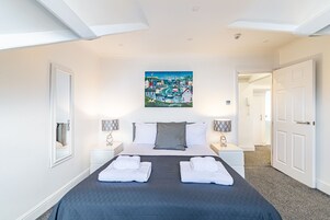 2 bedrooms, premium bedding, memory-foam beds, individually decorated