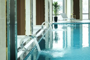 Indoor pool, open 7:00 AM to 9:00 PM, pool loungers, lifeguards on site