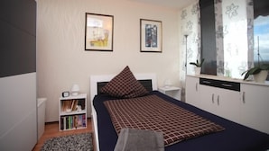 Apartamento, 2 quartos | Ferros/tábuas de passar roupa, Wi-Fi de cortesia, roupa de cama